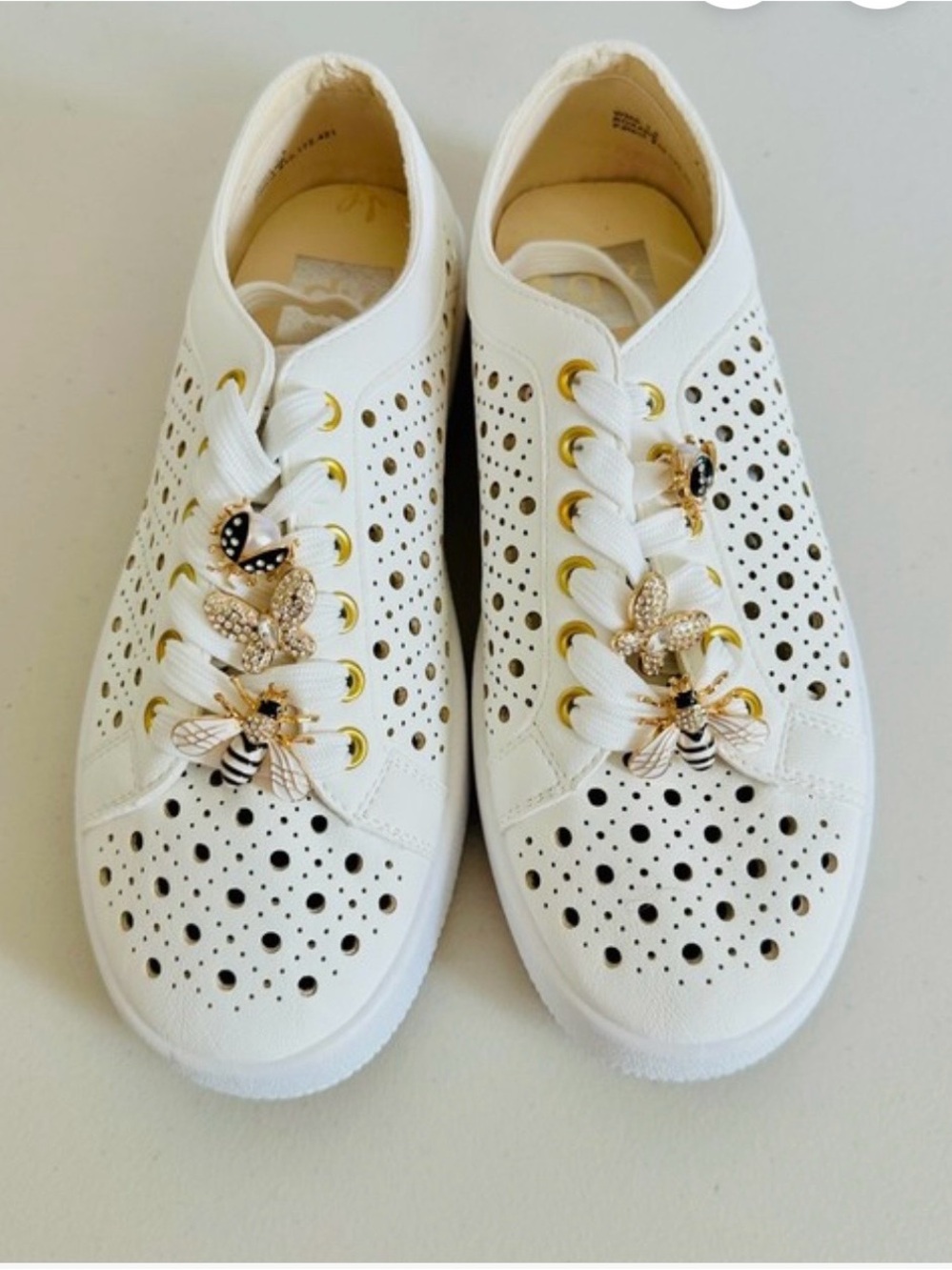 Dolce Vita White Perforated Sneakers with Gold Bee Charms